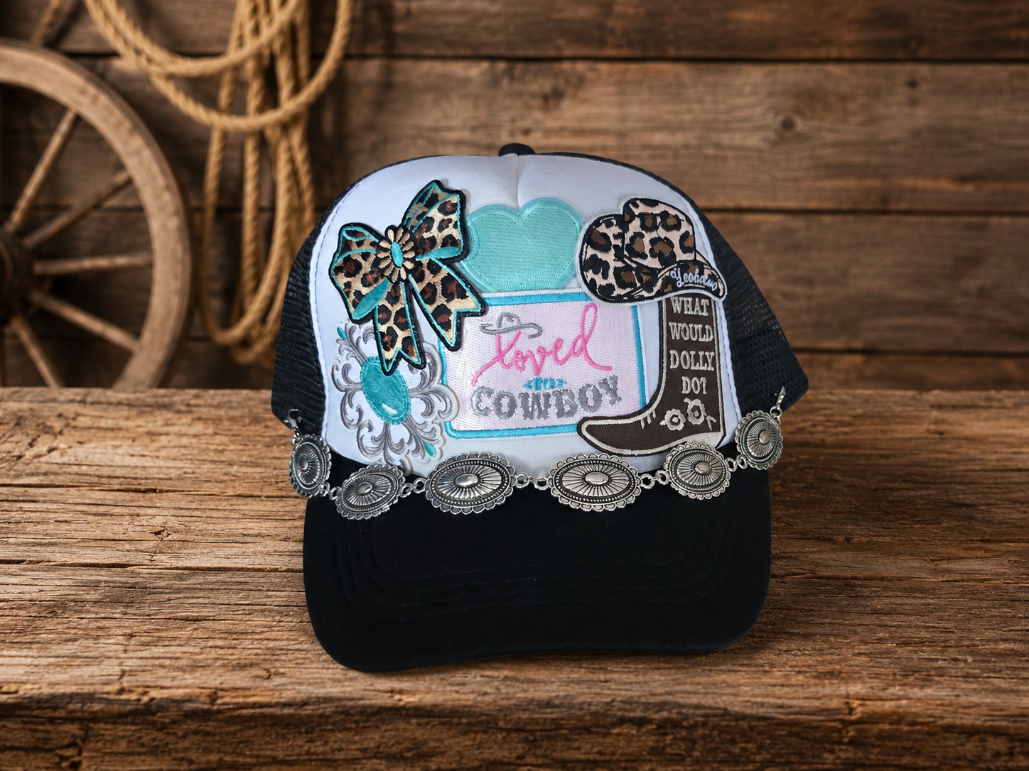 Loved by a Cowboy trucker hat